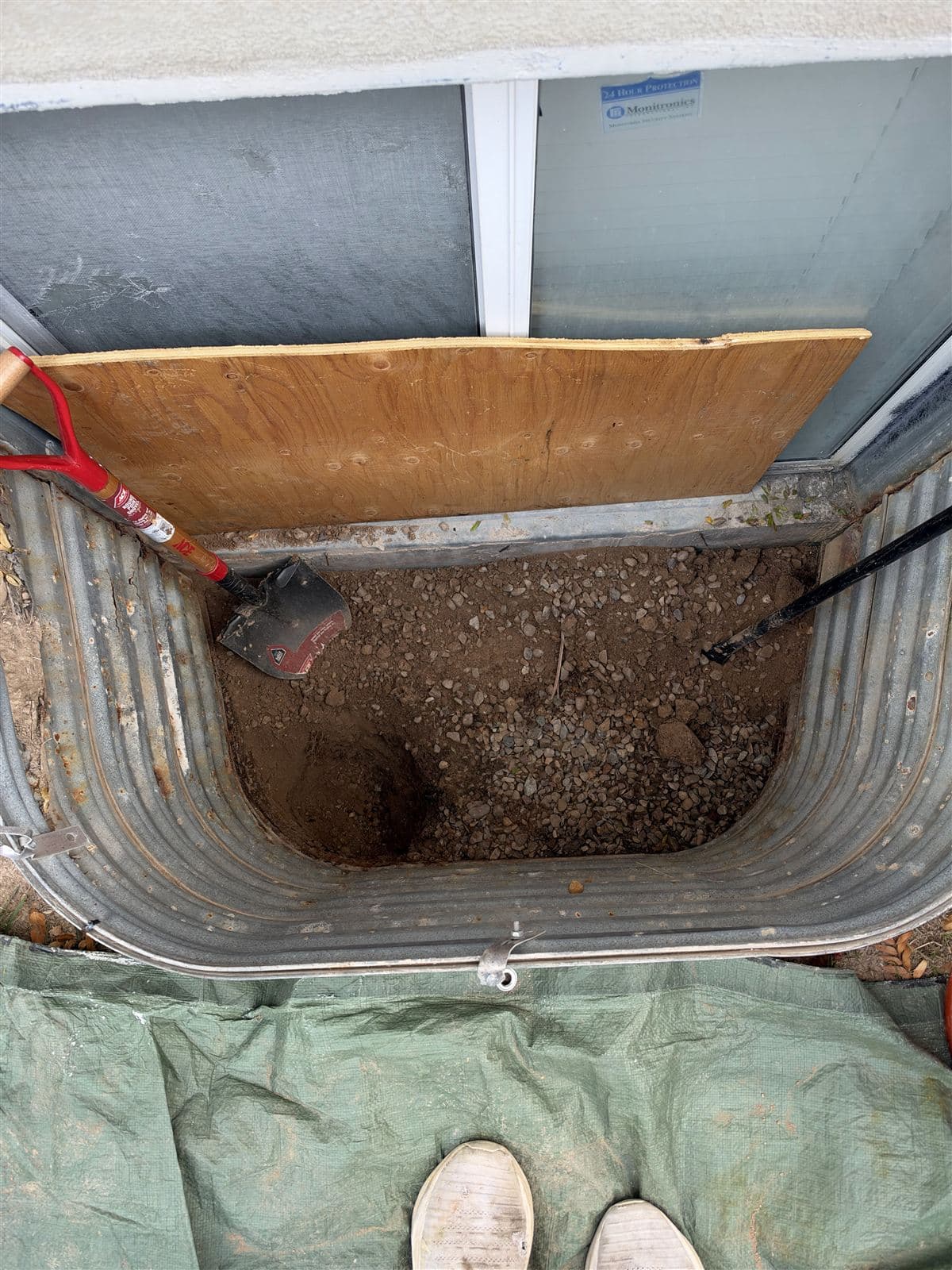 Well being excavated by hand with a shovel and digging bar